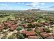 Expansive aerial view of a luxury neighborhood featuring tile roofs, golf course and desert landscape at 7600 E Golden Eagle Cir, Gold Canyon, AZ 85118
