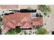 An aerial view shows the terracotta-tiled roof of this beautiful home with attached garage at 7600 E Golden Eagle Cir, Gold Canyon, AZ 85118