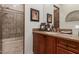 Cozy bathroom featuring shower, vanity, framed mirror and beautiful natural lighting at 7600 E Golden Eagle Cir, Gold Canyon, AZ 85118