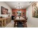 Elegant dining room featuring rustic wood table, stylish chandelier, and decorative accents at 7600 E Golden Eagle Cir, Gold Canyon, AZ 85118
