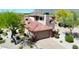 Beautiful multi-story home featuring terracotta tile roof, brick accents, and mountain views at 7600 E Golden Eagle Cir, Gold Canyon, AZ 85118