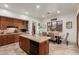 Well-appointed kitchen with stainless appliances, ample counter space, and adjacent dining area at 7600 E Golden Eagle Cir, Gold Canyon, AZ 85118