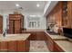 Open kitchen featuring custom wood cabinetry, granite countertops, and stainless steel appliances at 7600 E Golden Eagle Cir, Gold Canyon, AZ 85118