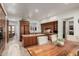 Spacious kitchen with custom wood cabinetry, granite countertops, and adjoining breakfast area at 7600 E Golden Eagle Cir, Gold Canyon, AZ 85118