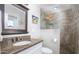 Bathroom featuring granite counters, modern sink, framed mirror, and a glass-enclosed shower at 8408 E Lewis Ave, Scottsdale, AZ 85257