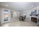 Office room with a brick fireplace, desk, and access to the outdoors through a glass door at 8408 E Lewis Ave, Scottsdale, AZ 85257