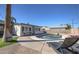 Backyard features a sparkling private pool surrounded by well-kept landscaping, seating and a patio at 8408 E Lewis Ave, Scottsdale, AZ 85257