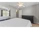 Bright bedroom with a ceiling fan, neutral walls, and a view of a mirrored closet, enhancing comfort and style at 8787 E Mountain View Rd # 2016, Scottsdale, AZ 85258
