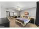 Comfortable bedroom with neutral walls, a ceiling fan, carpeted floor, and a mirrored closet, creating a relaxing atmosphere at 8787 E Mountain View Rd # 2016, Scottsdale, AZ 85258