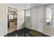 An inviting entryway features a black and white tile floor and a bedroom and backyard view at 8787 E Mountain View Rd # 2016, Scottsdale, AZ 85258