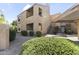 A charming condo featuring well-maintained landscaping and a two-story exterior design with private balconies at 8787 E Mountain View Rd # 2016, Scottsdale, AZ 85258