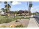 Inviting entrance to the Antigua Condominiums, featuring lush landscaping and an attractive community sign at 8787 E Mountain View Rd # 2016, Scottsdale, AZ 85258