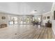 Large living room with lots of natural light, a dining table with chairs, and tile floors for easy cleaning at 8787 E Mountain View Rd # 2016, Scottsdale, AZ 85258