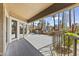 Large outdoor patio with railing, multiple chairs and tables, and views of the community swimming pool and mature landscaping at 8787 E Mountain View Rd # 2016, Scottsdale, AZ 85258