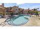 Beautiful community pool and spa surrounded by mature landscaping and plenty of seating to soak up the sun at 8787 E Mountain View Rd # 2016, Scottsdale, AZ 85258