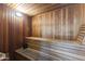 Home sauna room clad in wood with built-in benches, ready for relaxation and wellness at 8787 E Mountain View Rd # 2016, Scottsdale, AZ 85258
