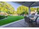Inviting backyard with lush green lawn and covered patio ideal for outdoor entertaining at 9041 N 46Th St, Phoenix, AZ 85028