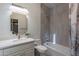 Modern bathroom featuring sleek tile work, elegant fixtures, and a shower-tub combination at 9041 N 46Th St, Phoenix, AZ 85028