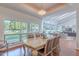 Bright dining room with a large window and hardwood floors showcases an open-concept layout and abundant natural light at 9041 N 46Th St, Phoenix, AZ 85028