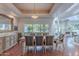 Elegant dining room featuring a large window and hardwood floors with classic wood furniture and stylish accents at 9041 N 46Th St, Phoenix, AZ 85028