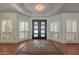 Beautiful entry with wood floors, large windows with plantation shutters, and a unique rug at 9041 N 46Th St, Phoenix, AZ 85028