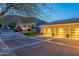 Exterior shot showing a three-car garage with mountain views in the background at 9041 N 46Th St, Phoenix, AZ 85028