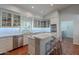 Bright kitchen featuring white cabinets, stainless steel appliances, and marble countertops at 9041 N 46Th St, Phoenix, AZ 85028