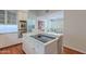 Bright kitchen featuring white cabinets, stainless steel appliances, and marble countertops at 9041 N 46Th St, Phoenix, AZ 85028