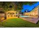 Beautiful backyard with an outdoor kitchen and a sparkling pool at 9041 N 46Th St, Phoenix, AZ 85028