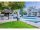 Stunning pool area with outdoor kitchen, perfect for entertaining at 9041 N 46Th St, Phoenix, AZ 85028