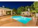 Lush backyard features a pristine pool, an outdoor kitchen, and a covered patio for ultimate relaxation and entertaining at 9041 N 46Th St, Phoenix, AZ 85028