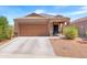 Charming single-story home with a two-car garage, a cozy front porch, and well-maintained landscaping at 4053 N 308Th Ln, Buckeye, AZ 85396