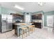Bright kitchen showcasing an island with seating, stainless steel appliances, and stylish countertops at 4053 N 308Th Ln, Buckeye, AZ 85396