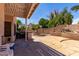Relaxing back patio with custom stone flooring and built-in grill at 4302 E Mountain Vista Dr, Phoenix, AZ 85048