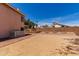 Spacious backyard with a block fence, offering privacy and a blank canvas for landscaping at 4302 E Mountain Vista Dr, Phoenix, AZ 85048