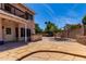 Spacious backyard with stone patio, grill and basketball hoop at 4302 E Mountain Vista Dr, Phoenix, AZ 85048