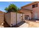 View of a storage shed in the backyard of a single-Gathering home with a brick patio at 4302 E Mountain Vista Dr, Phoenix, AZ 85048