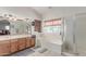 Bright bathroom with double sinks, separate shower, and a soaking tub for relaxation at 4302 E Mountain Vista Dr, Phoenix, AZ 85048
