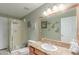 Bathroom featuring a large mirror, granite countertops, and an enclosed glass shower at 4302 E Mountain Vista Dr, Phoenix, AZ 85048