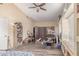 A spacious bedroom with a ceiling fan, wood-look floors, and a built-in window seat provides natural light at 4302 E Mountain Vista Dr, Phoenix, AZ 85048