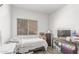 Bedroom featuring laminate flooring and natural lighting from one large window at 4302 E Mountain Vista Dr, Phoenix, AZ 85048