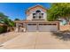 Charming two-story home featuring a three-car garage, covered porch, and well-maintained landscaping at 4302 E Mountain Vista Dr, Phoenix, AZ 85048