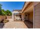 Inviting front entrance with a pergola-covered seating area, decorative gravel and welcoming door at 4302 E Mountain Vista Dr, Phoenix, AZ 85048