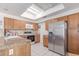 Well-equipped kitchen featuring a stainless steel refrigerator and ample cabinet space at 4302 E Mountain Vista Dr, Phoenix, AZ 85048