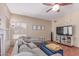 Cozy living room with a ceiling fan, comfortable seating, and natural light at 4302 E Mountain Vista Dr, Phoenix, AZ 85048
