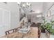 Bright living room with marble table, open staircase, and easy access to a cozy seating area at 4302 E Mountain Vista Dr, Phoenix, AZ 85048