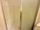 Neat walk-in shower includes a frosted glass door, tiled walls, and a drain, making it a clean space at , Tempe, AZ 85282