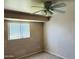 Comfortable bedroom features a ceiling fan and a window offering natural light, great for rest and relaxation at , Tempe, AZ 85282