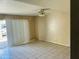 Bright living room with sliding glass doors and tiled floors, ideal for comfortable everyday living and entertaining at , Tempe, AZ 85282