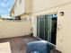Tiled backyard patio featuring sliding door and walled yard, offering privacy and outdoor living space at , Tempe, AZ 85282